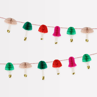 The Honeycomb Mushrooms Mini Garland from Meri Meri features red, green, pink, and beige mushrooms on a string against a white background—a perfect festive garland for your holiday decor or Mushroom Christmas decoration.