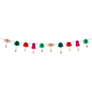 A festive Honeycomb Mushrooms Mini Garland by Meri Meri, featuring mushroom-shaped ornaments in red, green, and beige, hanging on a white background.