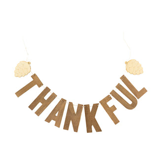 The My Mind’s Eye Harvest Wood Thankful Word Banner features real wood letters spelling "THANKFUL" and pinecone shapes at both ends, all strung together on rustic twine.