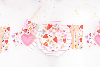 With Daydream Society's Heartbeat Gang Small Plates, heart-patterned napkins and cups, wooden cutlery, and a pink heart-shaped cookie, your festive table is complete. Neon accents and gold foil-pressed details modernize this Valentine's Day theme.