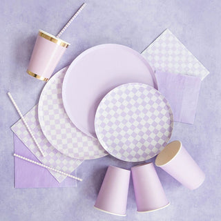 Jollity & Co’s Check It! Purple Posse Dinner Plates, purple cups with gold rims, striped straws, and napkins are perfectly arranged on a light purple surface—your party checklist is complete.