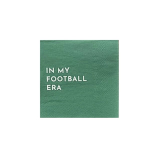 Green napkin with the white text "IN MY FOOTBALL ERA" printed on it, perfect for your Super Bowl party. These In My Football Era Cocktail Napkins by Bonjour Fête are made from eco-conscious materials, adding a touch of sustainability to your celebration.