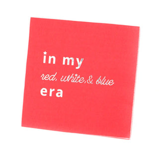 A red square card with holographic lettering saying "In My Red, White, and Blue Era Cocktail Napkin" by Kailo Chic, perfect for celebrating the 4th of July in style.