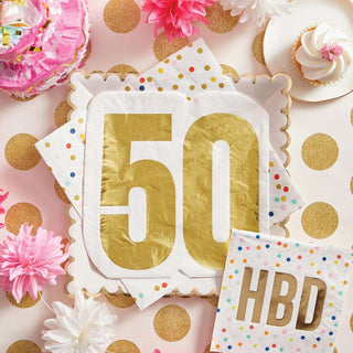 A festive table setting celebrating a 50th birthday with gold confetti, a large '50' centerpiece, and decorations including a cupcake and Slant Jumbo Shaped Napkins - 50 with 'hbd' (happy birthday) imprint.