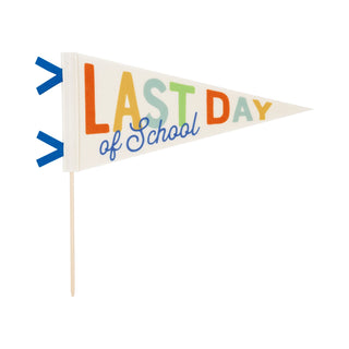 Colorful Last Day of School Felt Pennant banner with the phrase "LAST DAY of School" in multicolored letters, attached to a wooden stick, isolated on a white background by My Mind’s Eye.