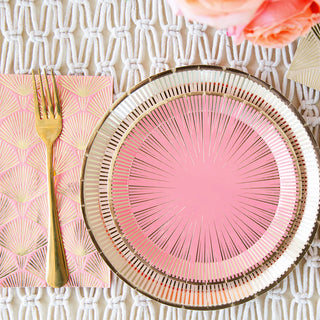 The La Boheme collection by Jollity & Co includes pink and gold paper plates elegantly paired with a lace tablecloth, matching napkins, and gold forks—ideal for party enthusiasts aiming for sophistication with elegant La Boheme Guest Napkins.