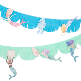 Two decorative banners featuring blue and green fringes, adorned with pastel-colored cutouts of mermaids, seashells, and a seahorse—perfect for an under-the-sea mermaid party. These charming Meri Meri Mermaid Fringe Garlands add a whimsical touch to your celebration.