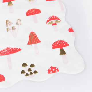 Close-up of the Merry Mushrooms Large Napkins by Meri Meri, showcasing a festive design decorated with various red mushrooms and minimal brown elements on a white background, perfect for a Christmas meal.