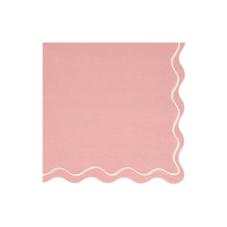 A pink Mixed Wavy Line Large Napkin by Meri Meri perfect for a party table.