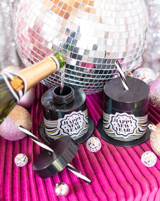 Get ready for the New Year with a Packed Party New Year's Eve Top Hat Novelty Sipper and disco balls - the ultimate party accessories. Cheers to a fantastic night ahead!