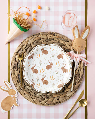 Easter table setting with bunny plates and napkins, featuring My Mind's Eye carrot treat bags for a touch of bunny-approved fun.