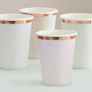 Four Ginger Ray Pastel Watercolor Party Cups with metallic gold rims placed on a light surface, perfect for any elegant occasion.