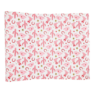 Rectangular wrapping paper with a pink background featuring a repeated pattern of red candy canes, yellow stars, and the letter "s" is ideal as a My Mind's Eye Pattern Paper Table Runner for a cowgirl-themed party.