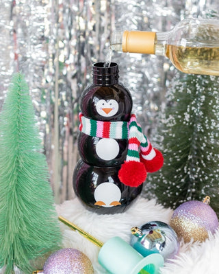 Get into the holiday spirit with this Packed Party Penguin Novelty Sipper, perfect for a jumbo-sized night of fun. This adorable penguin wine bottle comes with Christmas ornaments and a bottle of wine.