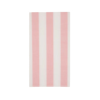 A pale Bonjour Fête Petal Pink Cabana Stripe Guest Towels or textile hung against a white background, showcasing a simple and clean design made from eco-conscious materials.