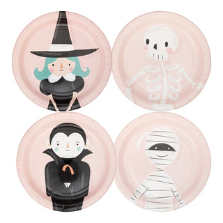 My Mind’s Eye's Pink Monster Plate Set includes four Halloween-themed paper plates showcasing cartoon characters: a witch, a skeleton, a vampire, and a mummy. These plates, designed with a light pink background, are perfect for your Halloween parties.