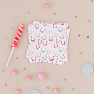 Pink and purple Pony Tales Petite Napkins perfect for cowgirls with a lollipop as an added touch. (Daydream Society)
