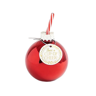 A Red Ornament Sipper, spherical with a silver top, contains a red and white striped straw and a tag reading "Have a cup of cheer!" Perfect for holiday parties. This festive product is offered by Paper Source.