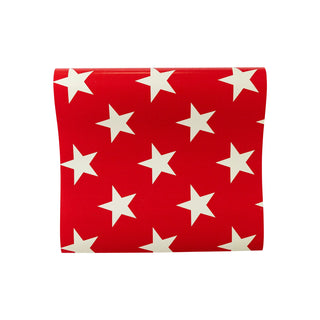 A vibrant Red Star Table Runner adorned with a pattern of white stars, likely a festive item for Memorial Day or Fourth of July celebrations, isolated against a white background by My Mind's Eye.