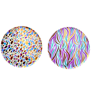 Two Safari Round Plates by Ma Fête are shown side by side: the left plate has a multicolored spotted pattern, and the right plate displays a wavy, colorful abstract design.