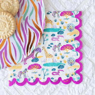 Safari Square Napkins by Ma Fête feature colorful safari animals and trees with playful scalloped edges, making them the perfect accent for cookies or treats at a safari-themed birthday party.