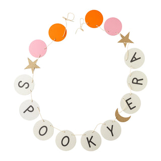 The Spooky Era Banner by My Mind’s Eye is a circular garland with white, orange, and pink paper disks arranged in an alternating sequence, spelling out "SPOOKYERA" and adorned with extra star and moon shapes. This Halloween party decoration also features subtle gold glitter accents to enhance its festive charm.