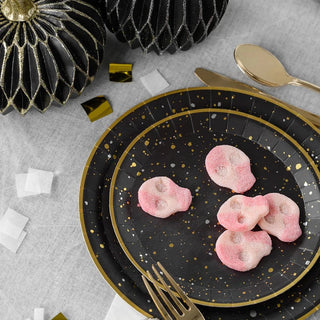 A sturdy Starry Night Small Plate by Coterie Party Supplies piled with pink marshmallows for a celestial-themed party.
