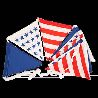 A collection of neatly folded Stars and Stripes Outdoor Banners by My Mind's Eye is arranged against a black background, symbolizing patriotism and national pride.