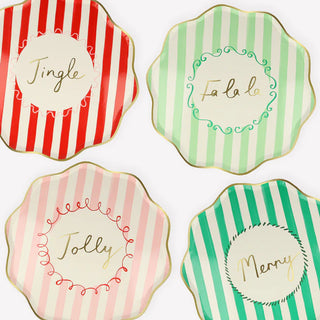 Celebrate the holidays with these four Meri Meri Striped Dinner Plates made from sustainable FSC paper. Each plate features the words "jingle bells, jingle bells, jingle bells, jing.