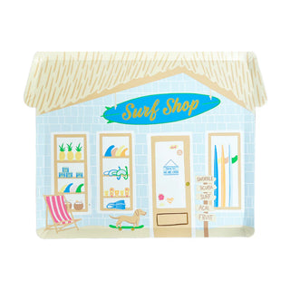 Illustration of a shop featuring the essence of beachside surf culture, showcasing Surf's Up Surf Shop Large Plates, surfboards, snorkeling gear, and additional items. Outside the shop, a beach chair and a dog on a skateboard reflect the Daydream Society vibe.