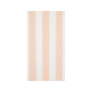 A plush, vertically striped Sweet Peach Cabana Stripe guest towel with alternating white and sweet peach bands, presented against a clean, white background by Bonjour Fête.