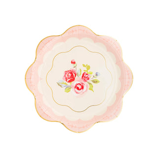 A My Mind’s Eye Tea Party Scalloped Round Paper Plate with scalloped edges, featuring a central floral pattern of pink and red roses with green leaves, surrounded by a cream and light pink background—perfect for elevating any tea party setting.