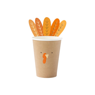 The My Mind’s Eye Turkey Paper Cup showcases an adorable turkey face design with attached orange and yellow tail feathers, making it perfect for entertaining Thanksgiving guests at your holiday gathering.