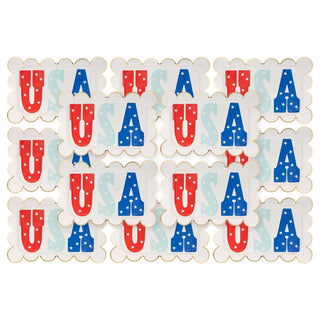 A collection of My Mind's Eye USA Scallop Paper Plates featuring letters in red and blue adorned with stars and stripes, symbolizing the American flag's colors and pattern, perfect for enhancing patriotic party supplies.
