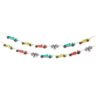 Two strings of the Merrilulu Vintage Race Car Party Garland, featuring red, yellow, and green cars interspersed with black and white checkered flags, create a festive race car birthday party display. This vibrant garland serves as perfect wall decor for your celebration.