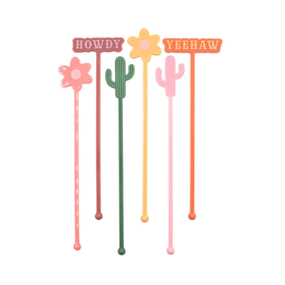 The NPW Western Drink Stirrers set includes five colorful cocktail mixing stirrers featuring shapes of flowers and cacti, with two proudly displaying the text "HOWDY" and "YEEHAW.