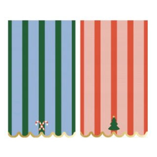 Two whimsical guest napkins with vertical stripes: the left napkin is blue and green featuring a candy cane design, while the right is red and green adorned with a Christmas tree at the bottom. The Whimsical Christmas Dual Striped Guest Napkins from Paper Source are perfect for adding charm to your next festive gathering or whimsical party.