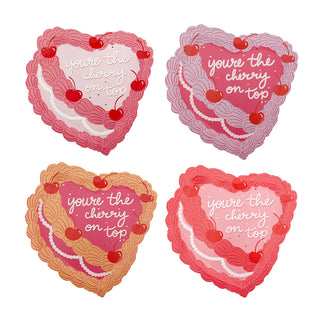 The "You're the Cherry On Top Dessert Plates" by Jollity & Co are a romantically sweet collection featuring four heart-shaped, die-cut plates with scalloped edges in pink and red tones. Embellished with cherry illustrations and the phrase "you're the cherry on top," they exude vintage Victorian vibes ideal for any charming table setting.