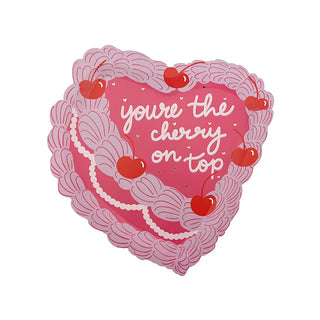 Illustrated heart-shaped design featuring pink swirls, cherries, and subtle gold foil accents. The text says "you're the cherry on top." Product: You're the Cherry On Top Dessert Plates by Jollity & Co.