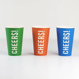 Three colorful, recyclable Cheers Red Paper Cups by Talking Tables with the word "CHEERS!" printed in white on each, against a plain white background.