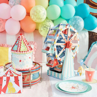 A circus themed birthday party with shiny stars and a ferris wheel. Made from FSC mix paper, the decorations include Meri Meri Circus Cups for a festive atmosphere.