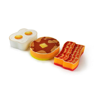 The Breakfast Scrub from Fred and Friends includes three high-quality sponges, each shaped like classic diner plate items: two fried eggs, a pancake with butter, and a strip of bacon.