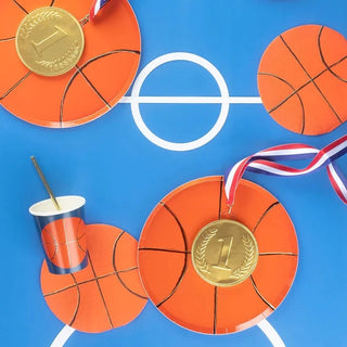 Elevate your basketball party with Meri Meri Basketball Plates and cups accented with gold foil, complete with a gold medal.