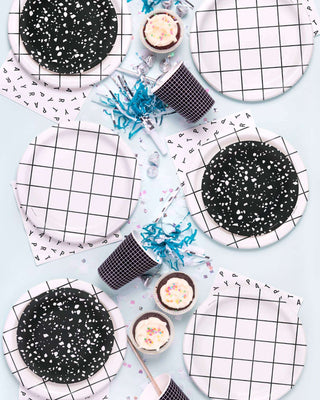 Party Scramble Party NapkinsThis assortment of paper plates, cups, and napkins can be mixed and matched to create table settings that are festive and fresh, never boring. All tableware is made Knot & Bow