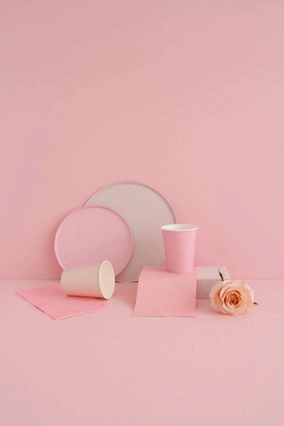 Blush 9in plates and cups on a pink background, designed to match perfectly by Oh Happy Day.