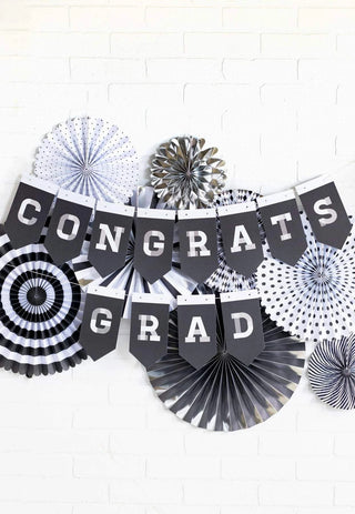 CONGRATS GRAD BANNERCongratulate your graduate with this pennant word banner. This banner includes the letters needed to complete the phrase "Congrats Grad" in a neutral black and whiteMy Mind’s Eye