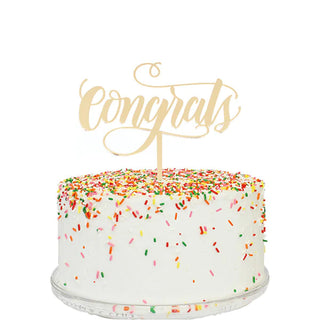 A cake with a food-safe Alexis Mattox CONGRATS MIRROR CAKE TOPPER that says congratulations, made in USA.