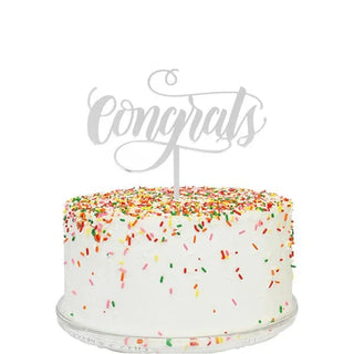 A cake with an Alexis Mattox CONGRATS MIRROR CAKE TOPPER that says congratulations, made in USA.