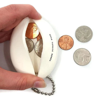 A person holding a Three Potato Four vintage-inspired Coin Pouch - I Have No Money with coins in it.