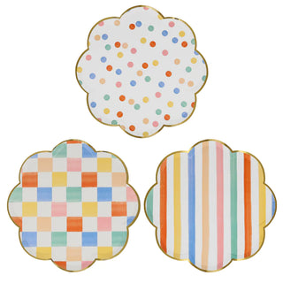 Three Meri Meri Colorful Pattern Dinner Plates with polka dots on them.